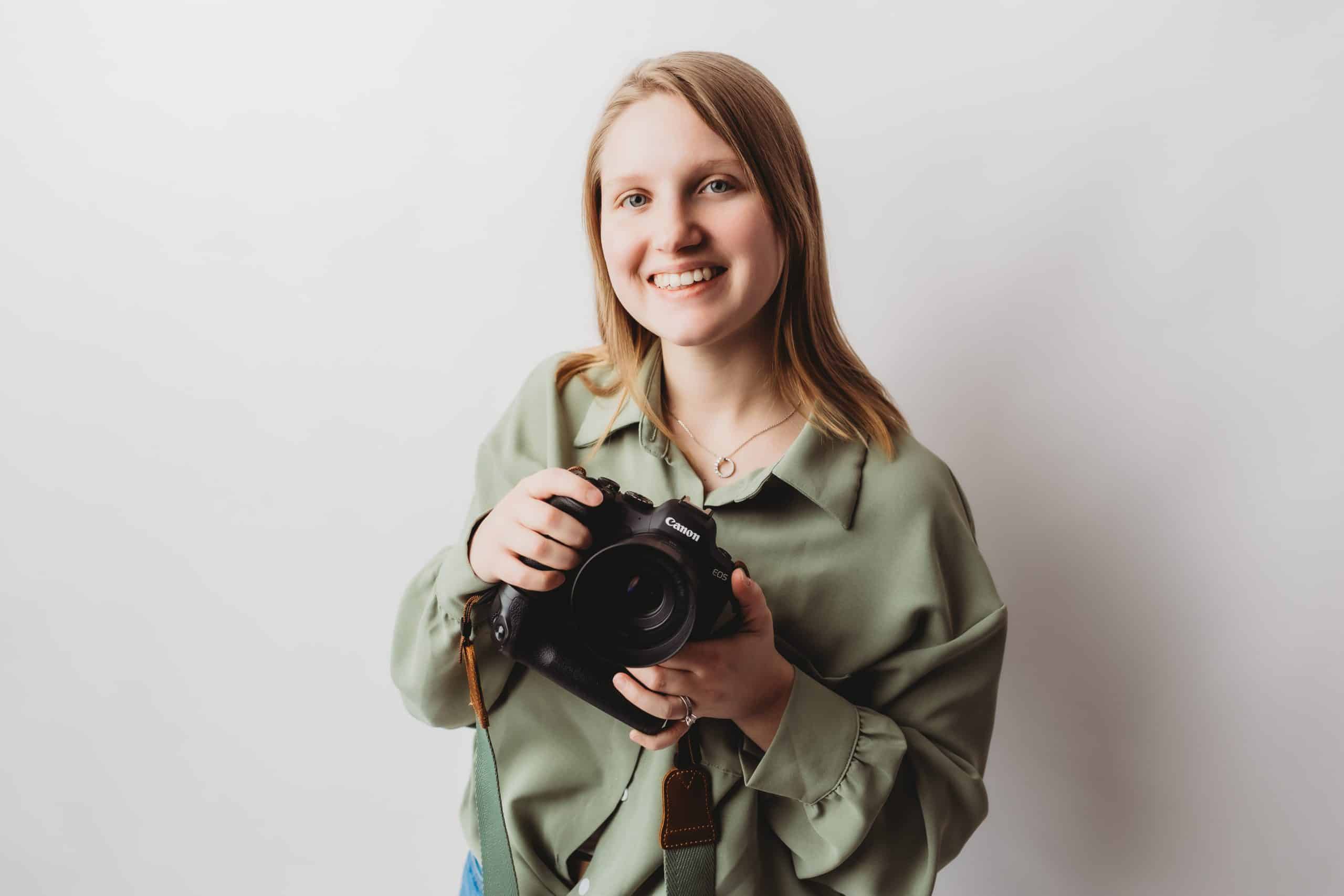 Kayla Toole holding her camera